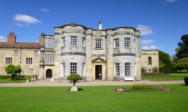 South front of Newburgh Priory showing elevation of stone building and grassed lawns in front