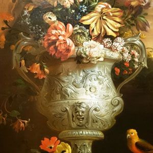 A painting of flowers in a silver urns.