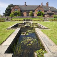 Formal pond at Goddards Garden in June in York, North Yorkshire. Image reference 304889. ©National Trust Images/Mark Sunderland. www.nationaltrust.org.uk