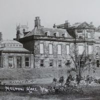 Figure 10. Photograph of the Hall (West Front) with island bed planting, c 1900.
